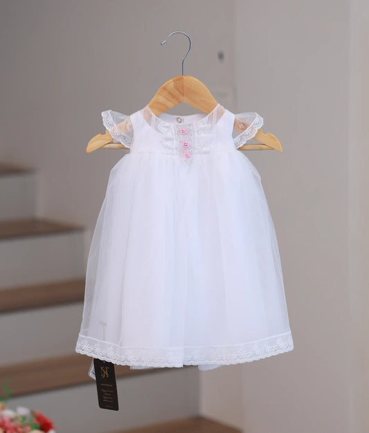 Front view of elegant handworked baptism set for baby girls.