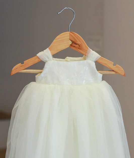 Close-up of intricate hand-stitched floral embroidery and beadwork on the bodice of style 5585 baptism gown.