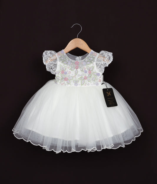Off-white tulle flower girl dress with floral embroidery bodice and ruffled sleeves for baptism.