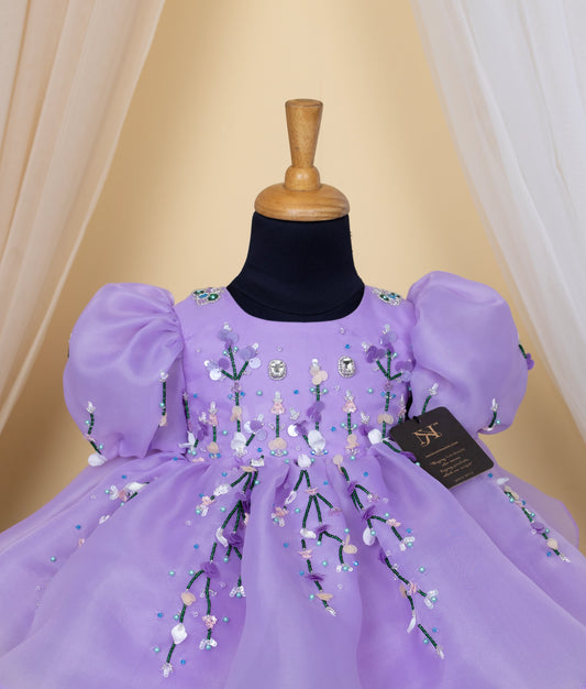 Front view of baby girl purple frock with embroidered flowers and full tulle skirt