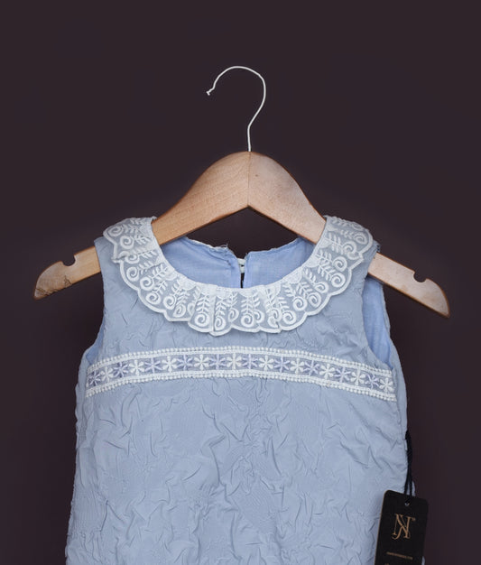 Birthday frock for baby girl in sky blue with front lace accents