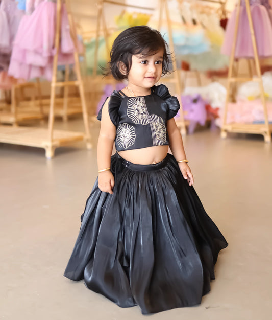 The black lacer organza floral embroidery skirt and top set for baby girls showing the intricate golden needlework