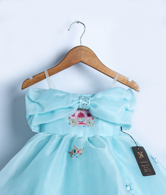 Close-up of the frock bodice showing the large structured bow and intricate royal carriage embroidery