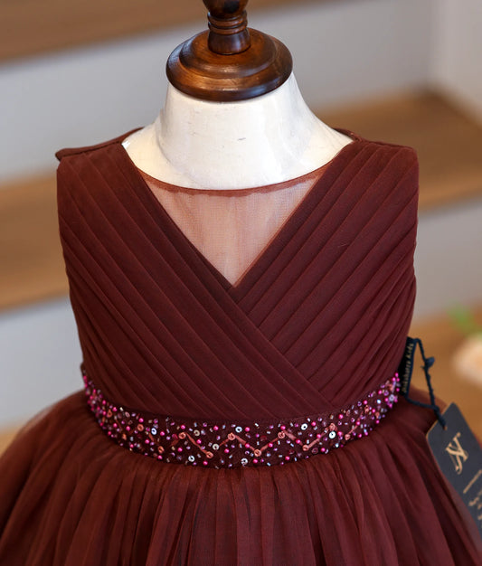 Close-up of the handworked beads and sequins on the coffee-brown frock waistband.