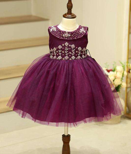 Front view of the dark purple handworked birthday frock for girls featuring a cape-style collar and intricate floral pearl embellishments.