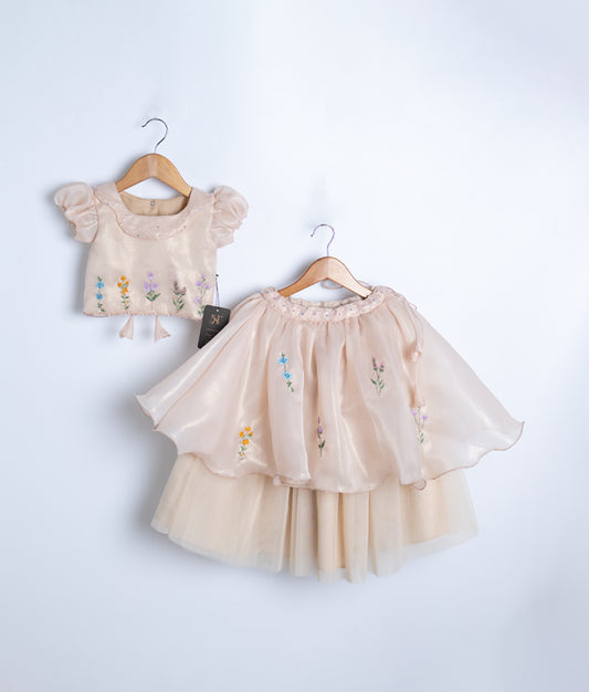 Front view of a golden two-piece western outfit for girls featuring a floral embroidered short top and full skirt