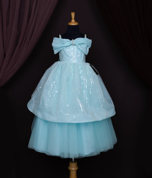 Light blue tiered dress with bow bodice and layered tulle skirt displayed on black mannequin for girls