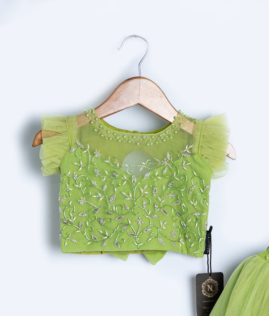 Light green knitted crochet top for toddler girls with short sleeves and decorative stitching