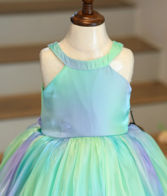 Close-up of the halter neck design and the vibrant green and pink multishade fabric.