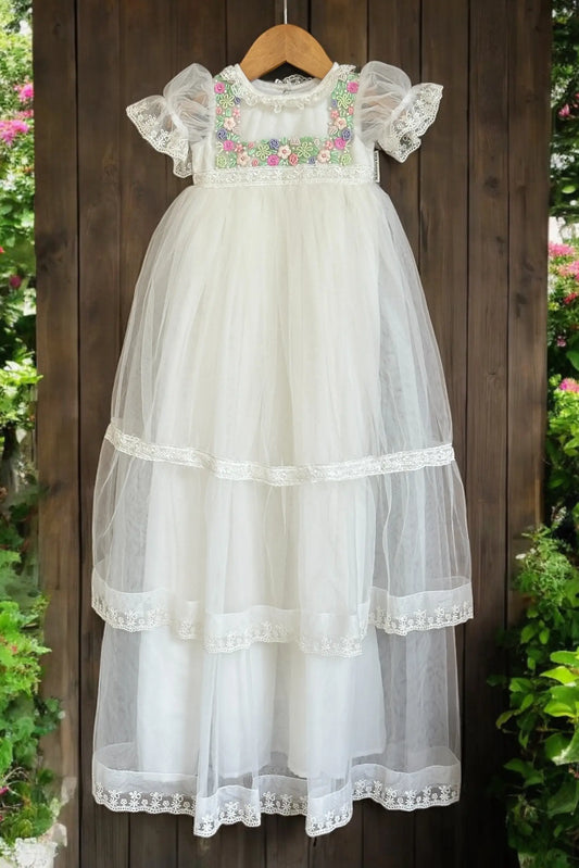 Elegant off-white baby girl baptism frock featuring intricate hand-embroidery and delicate lace detailing