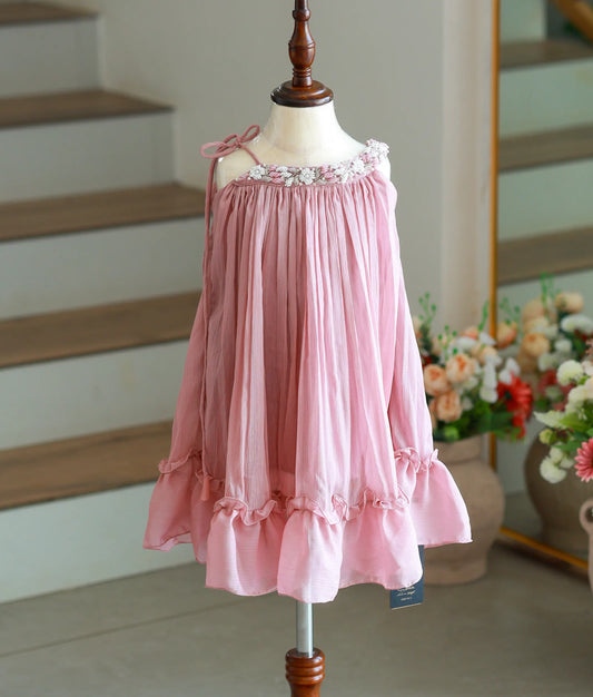 Front view of an onion pink shimmer georgette knee-length frock with pleated detailing.
