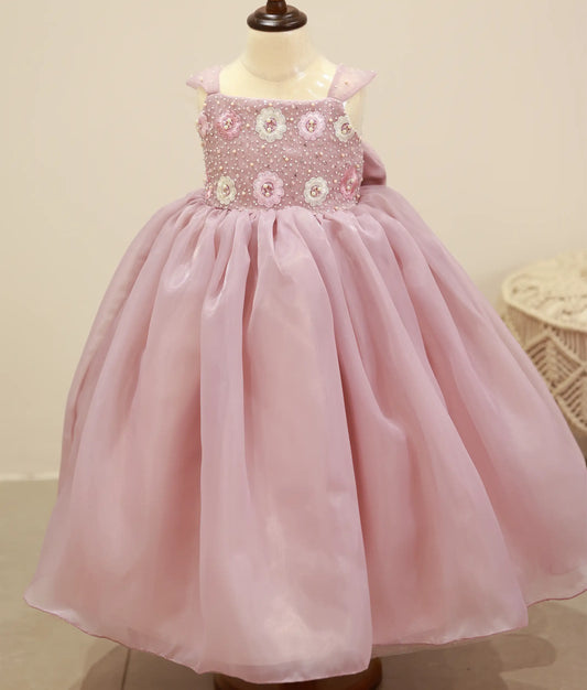 Front view of a pastel lavender satin organza handwork gown for baby girls with a voluminous layered skirt