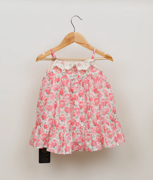 Pink floral printed cotton frock with square-neck lace trim and pleated skirt for baby girls.