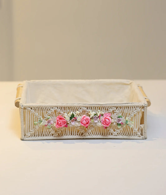 Hand-decorated pink baptism basket for baby girl featuring white lace, silk flowers, and premium fabric lining