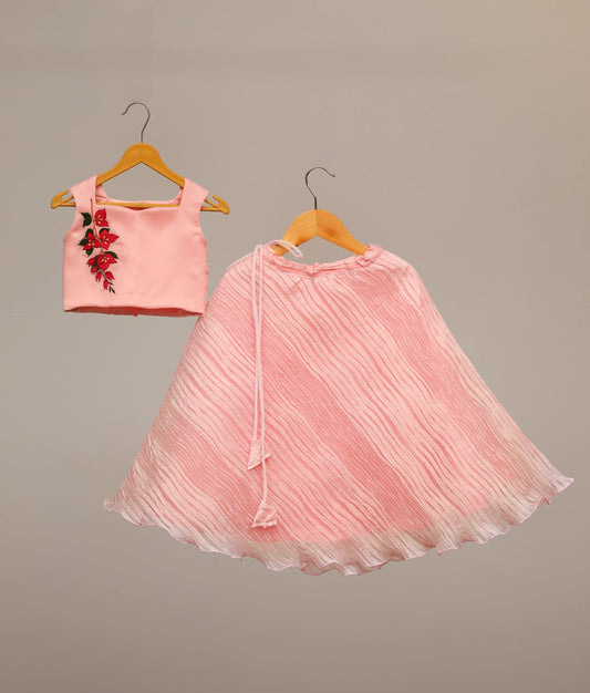 Front view of baby girl pink organza top with floral embroidery and tucked organza bottom