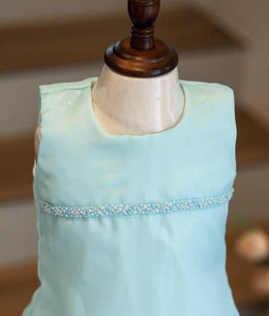 Close-up of the bead and sequin handwork and the shiny organza texture on the sky blue frock.