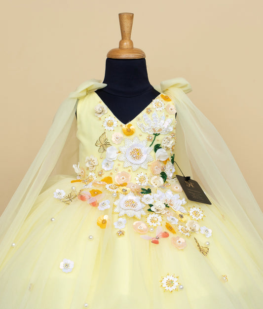 Front view of toddler cream and yellow floral dress with embroidered flowers and full tulle skirt