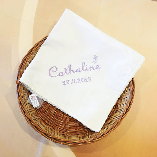 Soft white cotton baptism towel for babies with delicate floral embroidery and scalp borders