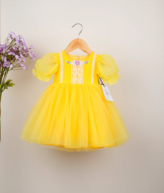 front view of yellow embroidery casual frock against plain background