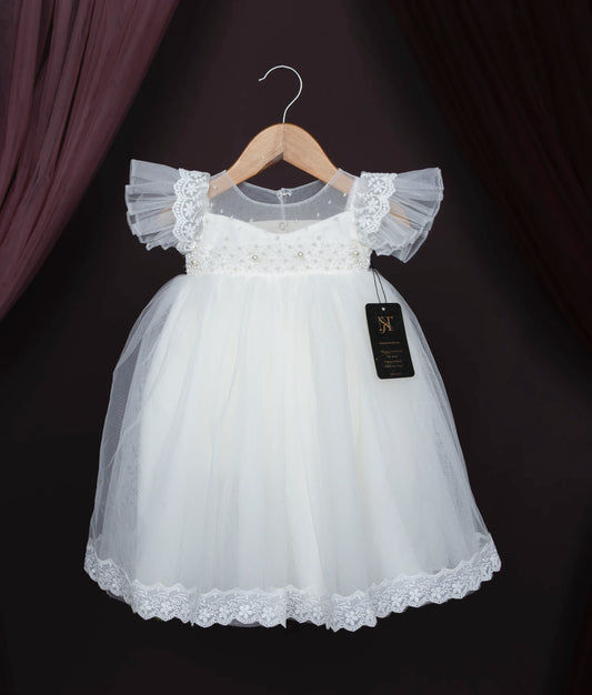 Off-white baby girl baptism dress with lace, pearls, and frilled sleeves on a hanger.