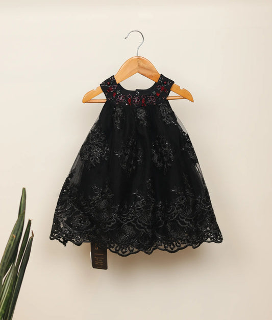 Front view of work material a-line handworked frock against plain background