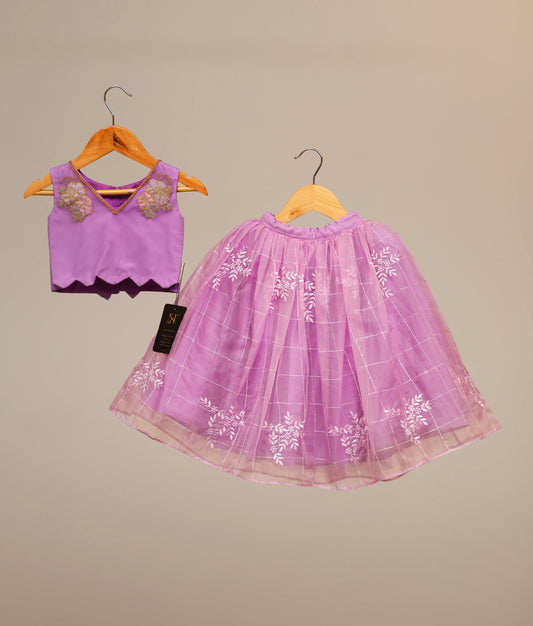 Lavender kids' lehenga choli short top and organza check skirt featuring white floral embroidery.