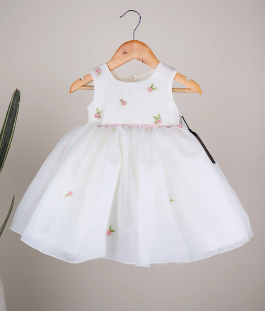 Front view of an off-white crush organza flower-themed dress against white background