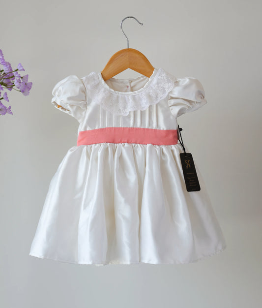 Front view of off-white Satin Organza Baptism Frock against plain background.