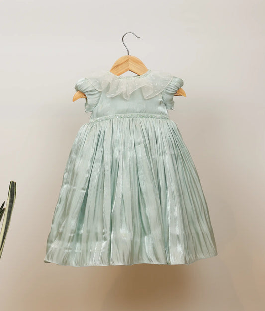 Front view of pastel green laser organza birthday gown