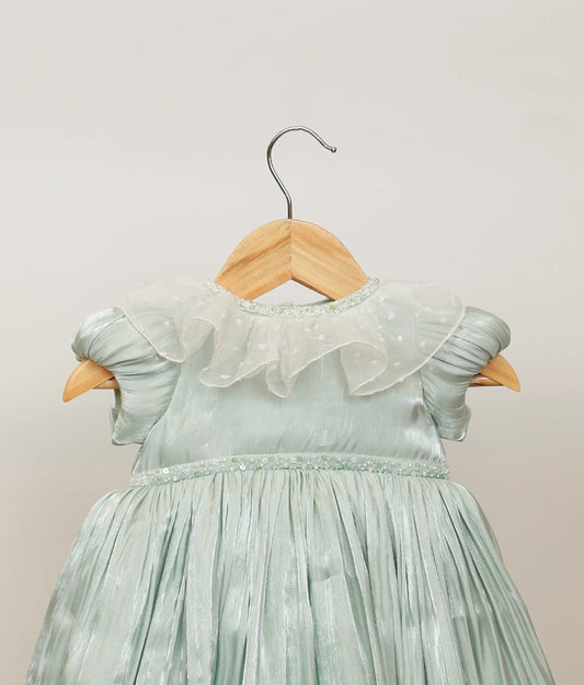 Close view of pastel green laser organza birthday gown