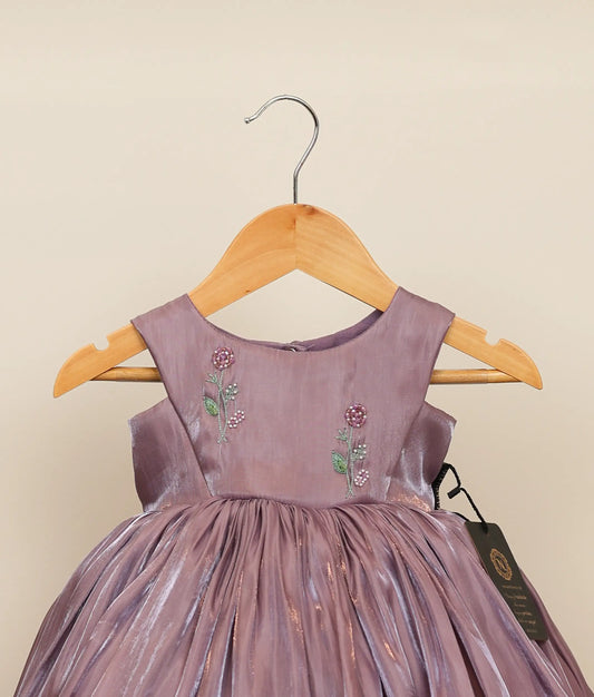 Close view of an pastel lavender lacer organza floral handworked birthday frock