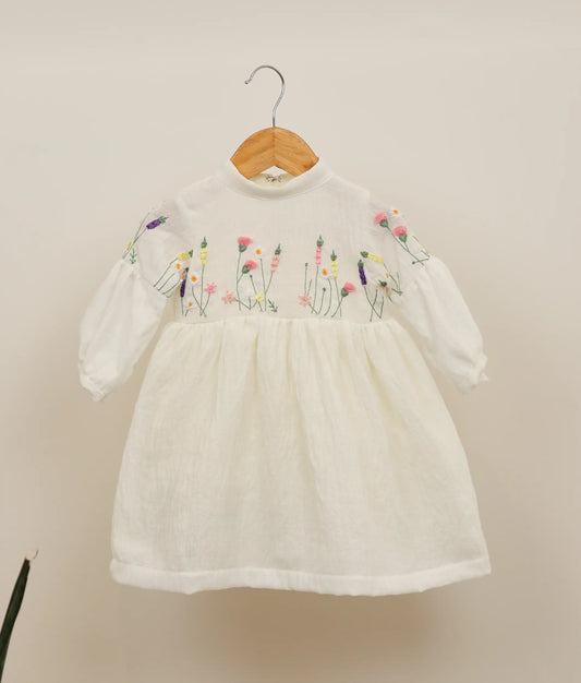 Front view of a linen cotton floral embroidery casual frock against plain background