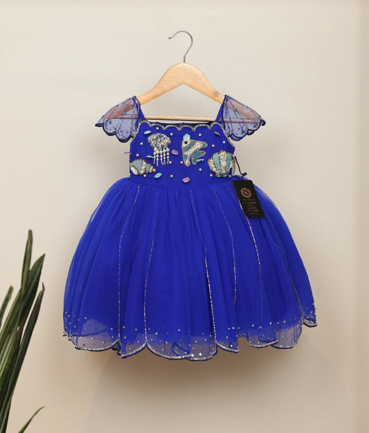 Front view of royal blue tulle net handworked mermaid-themed frock for baby girl