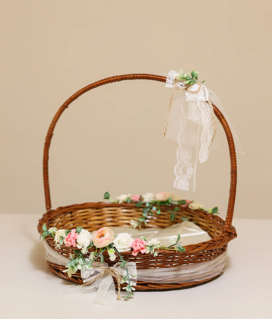 Floral wicker basket for christening against plain background