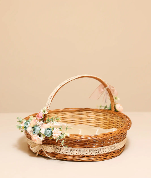 Peach and peacock blue wicker baptism basket against plain background