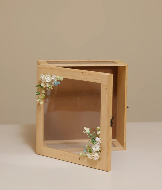 Off-white decorative flower wicker baptism basket against plain background