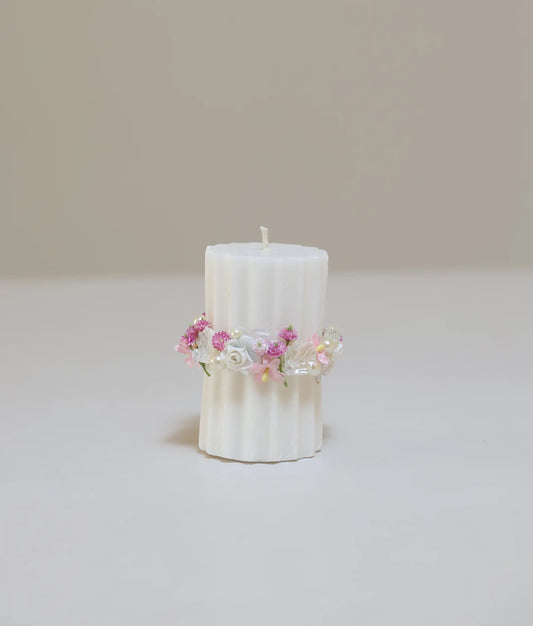 Front view of off-white and pink floral flower pillar candle for your baby baptism