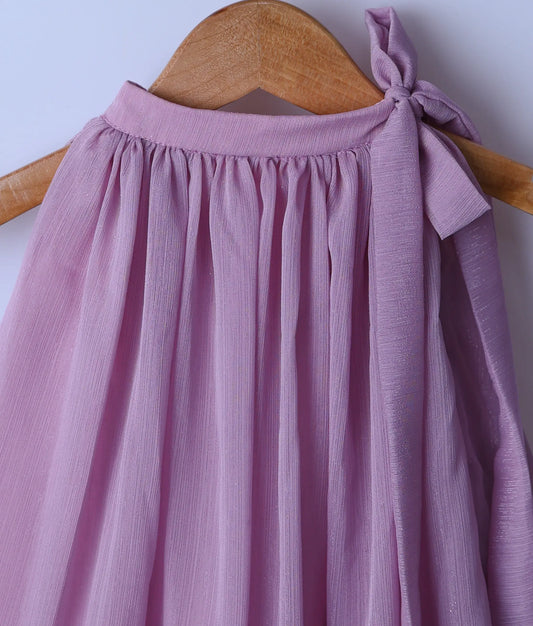 Close view of an pastel lavender halter-neck sleeveless casual frock displayed on a wooden hanger.
