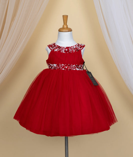 A red tulle net dress with floral embroidery is displayed on a mannequin.