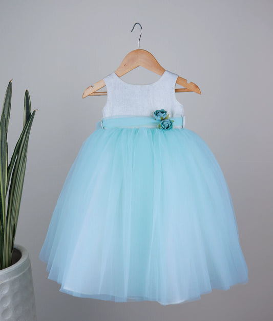 Front view of an off-white milan foil yoke with sky blue skirt birthday frock against white background