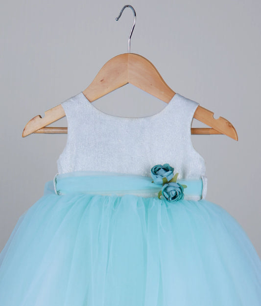Close view of an off-white milan foil yoke with sky blue skirt birthday frock against white background