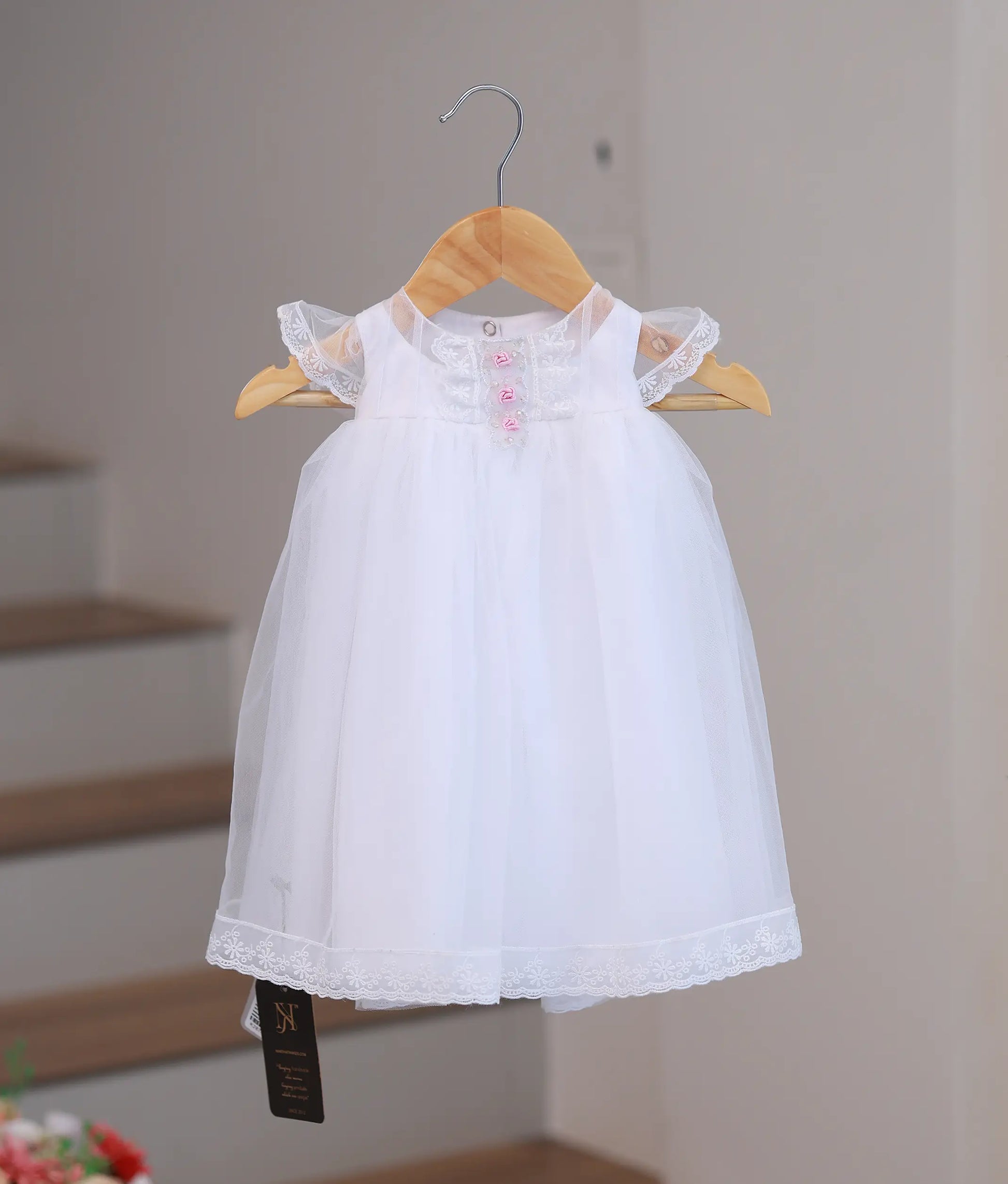 Front view of elegant handworked baptism set for baby girls.