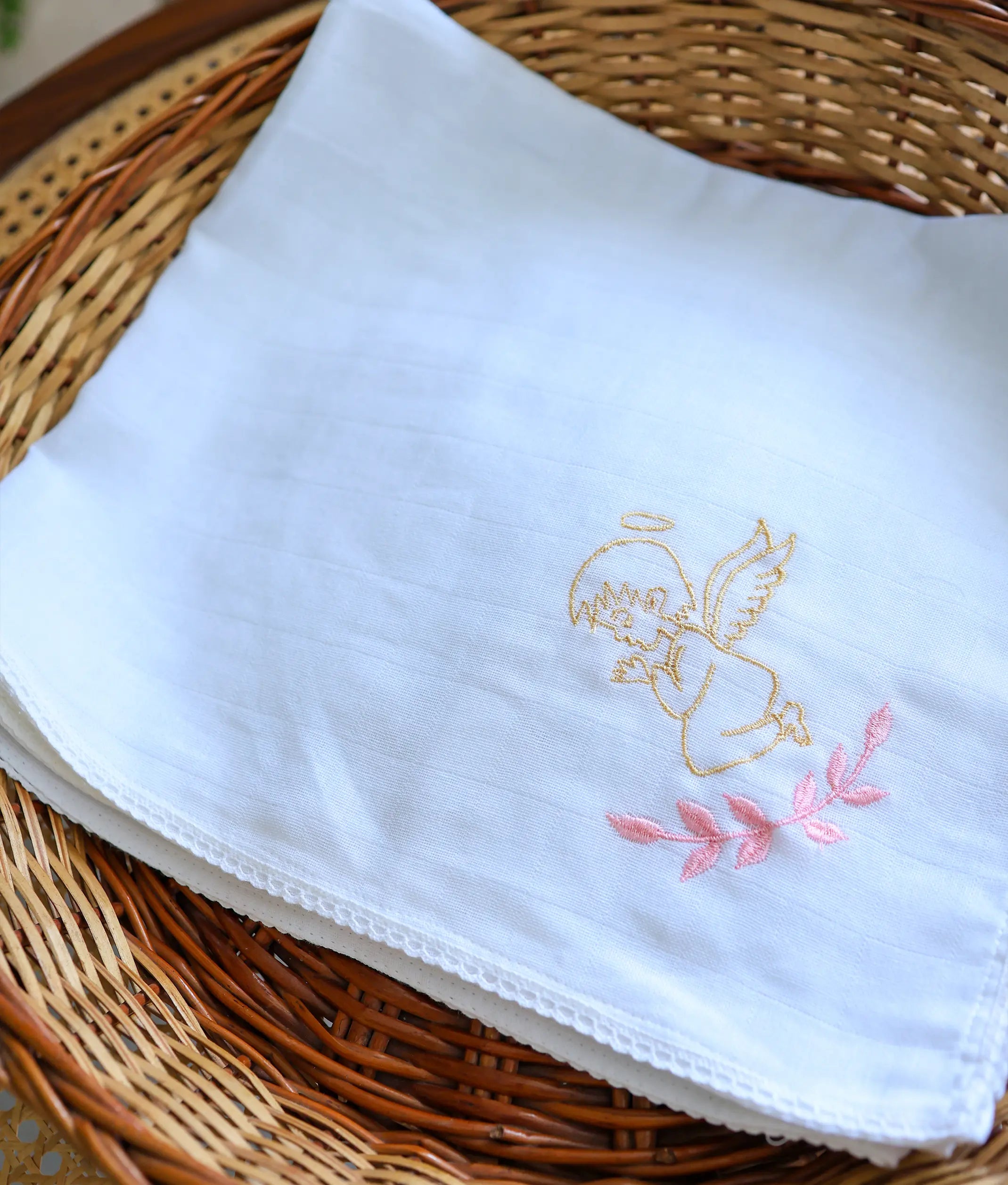 Front view of an off-white angel embroidery cotton baptism towel.