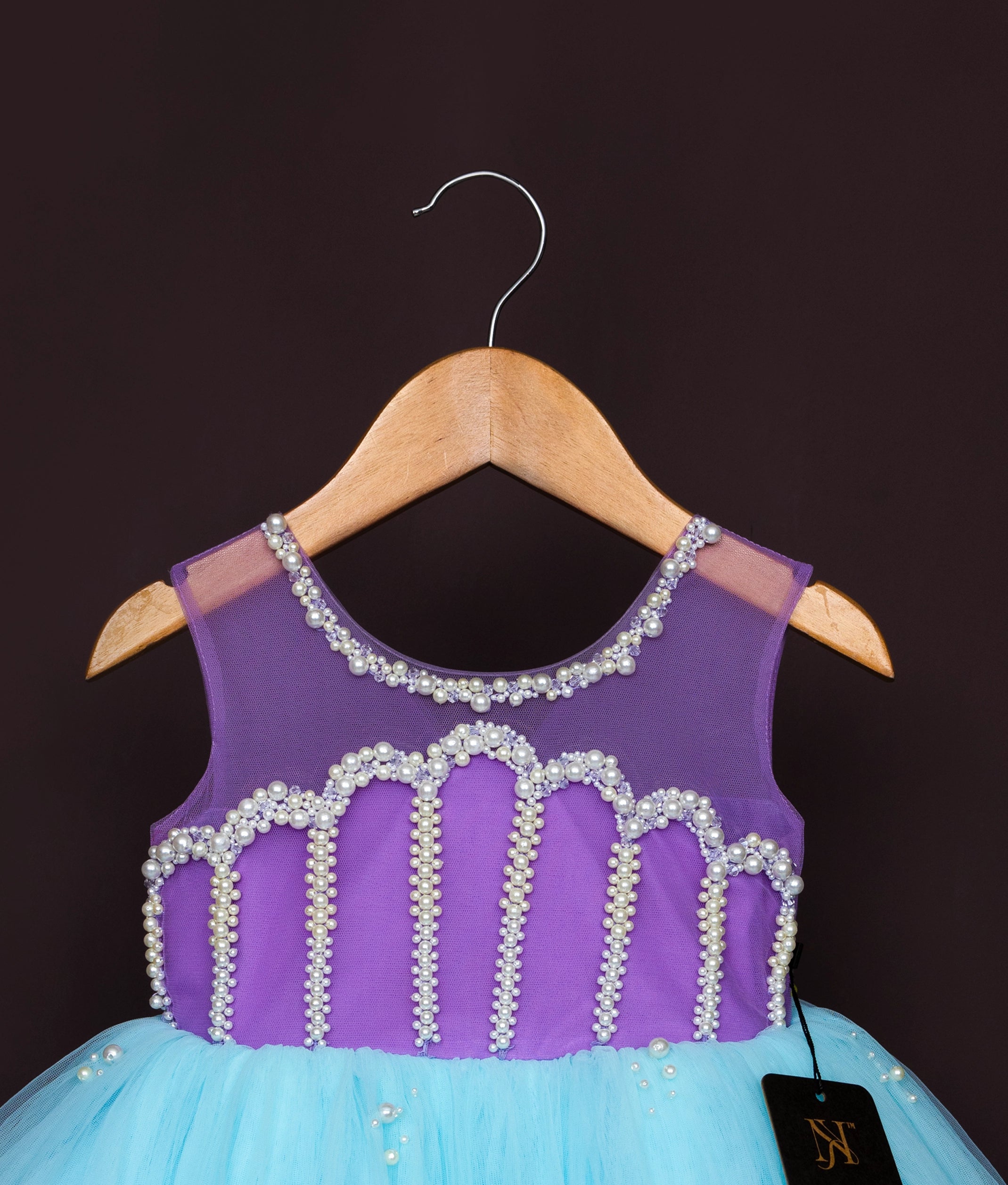 Front view of aqua and purple dress with color block striped bodice and elegant formal design
