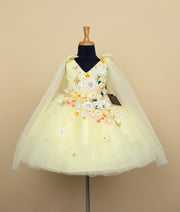 Baby girl cream colored formal dress with floral embroidery and tulle skirt on dress form mannequin