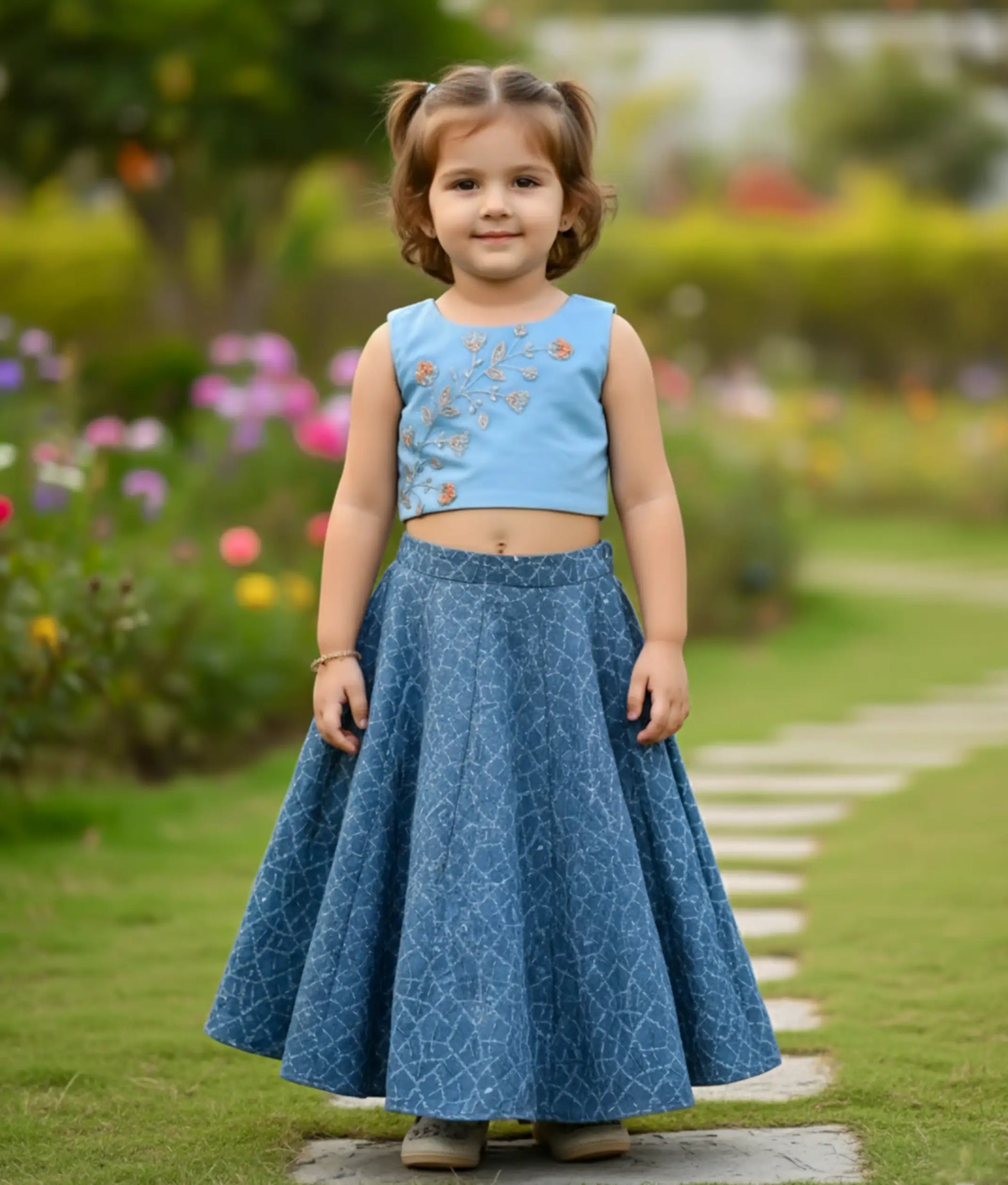 Baby girl wearing a blue handworked top and ash georgette skirt