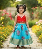 A baby girl wearing the red square neck handworked top paired with a sky blue digital floral printed organza skirt