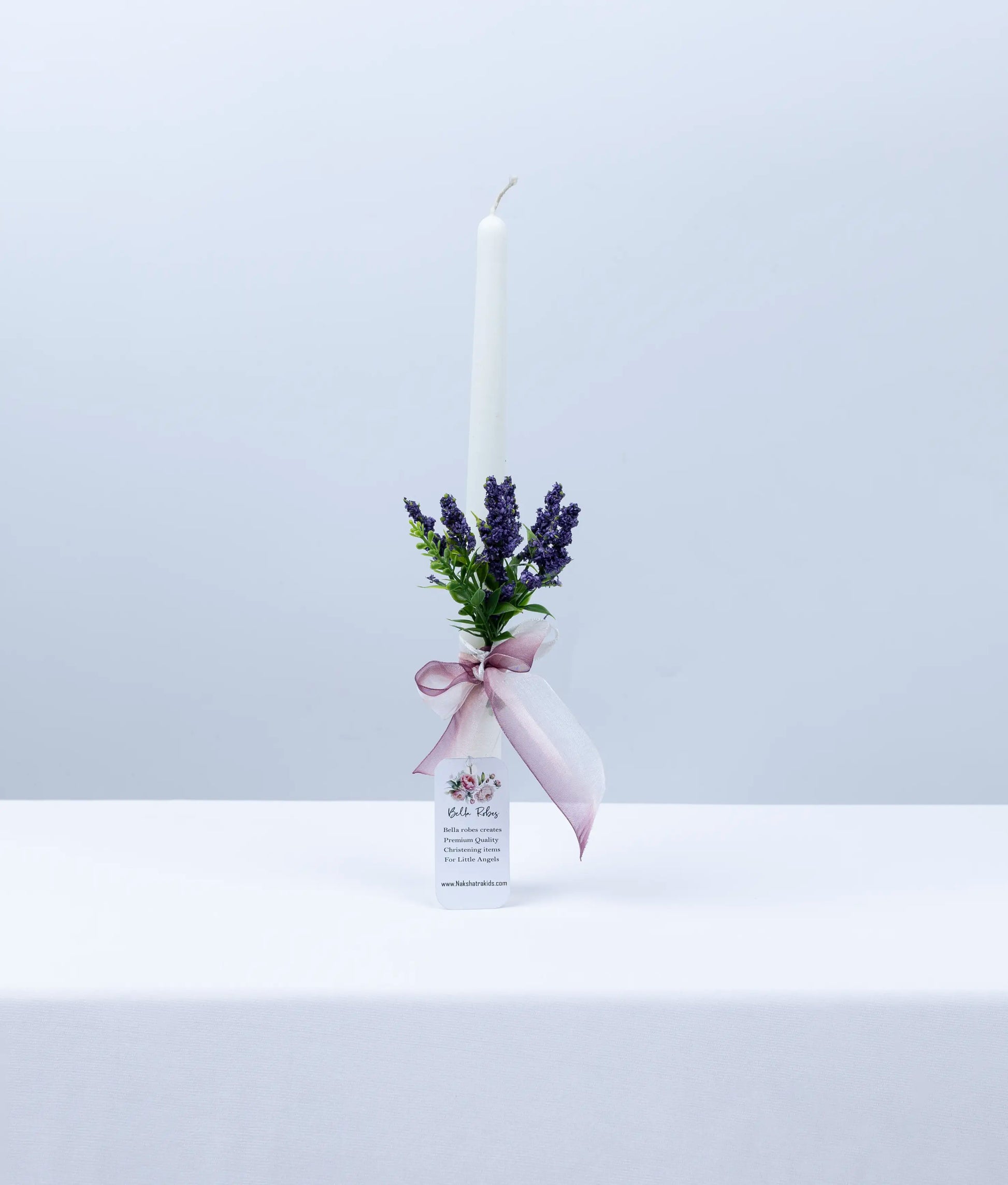 Close-up of intricate handworked lace and pearl detailing on a designer baptism ceremony candle