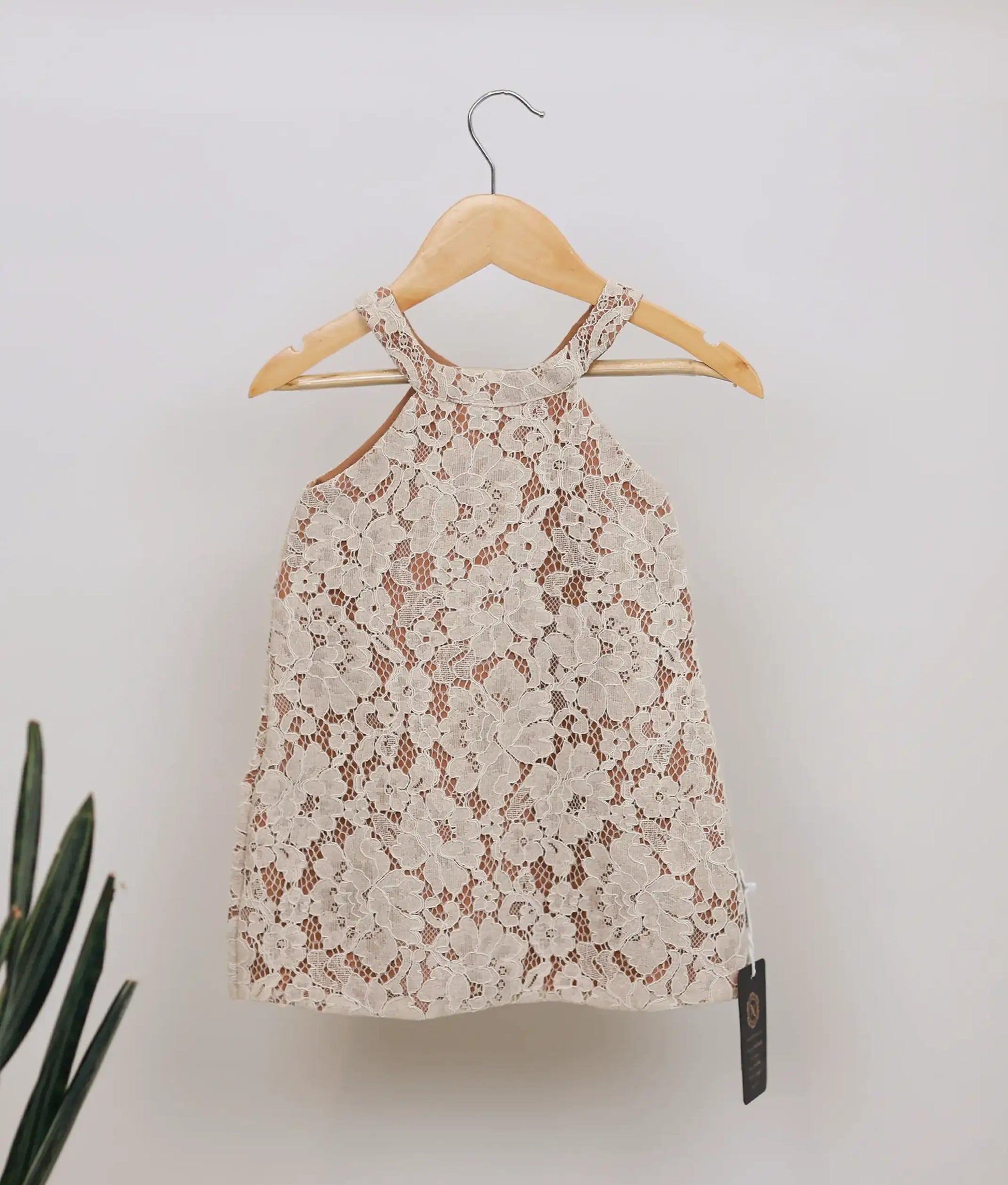 Beige wedding lace sleeveless A-line frock with round neck for baby girl.