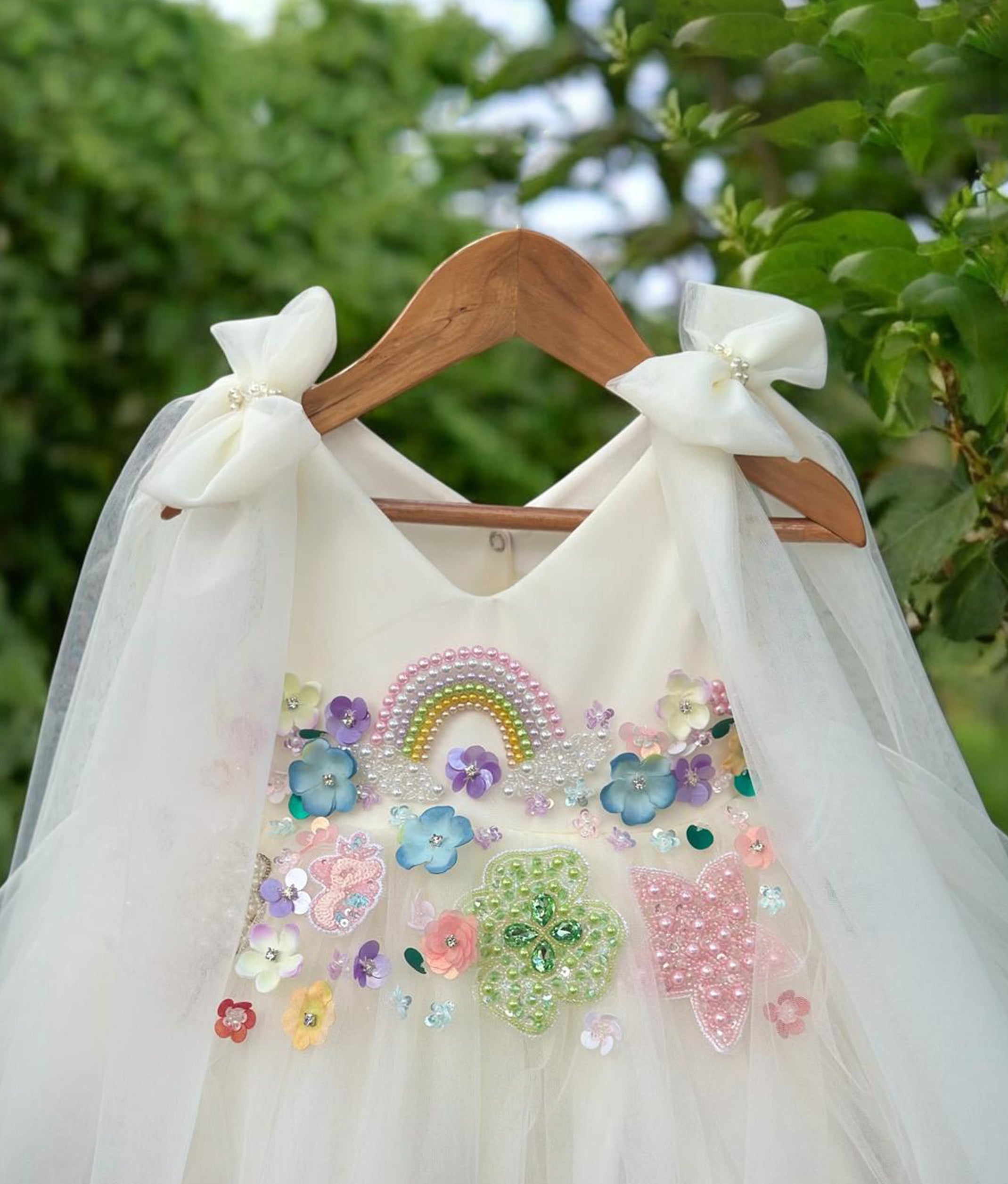 Charming birthday frock for baby girl with multicolor flower designs and soft net fabric